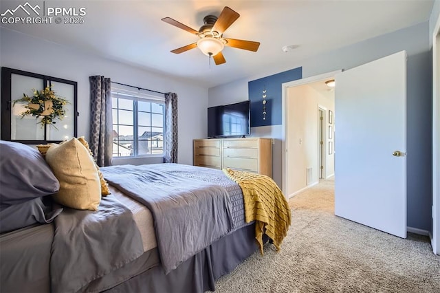 carpeted bedroom featuring ceiling fan