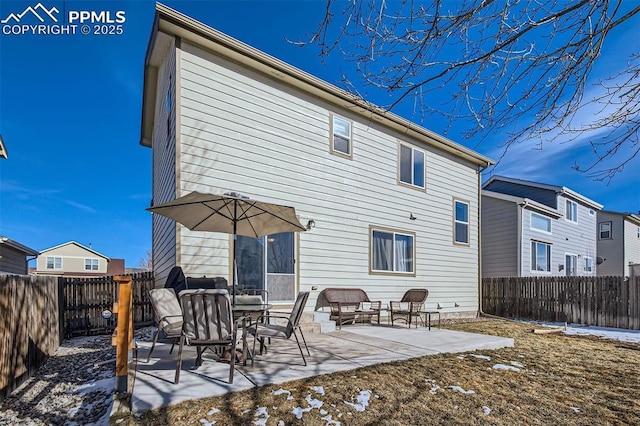 back of property with a patio area