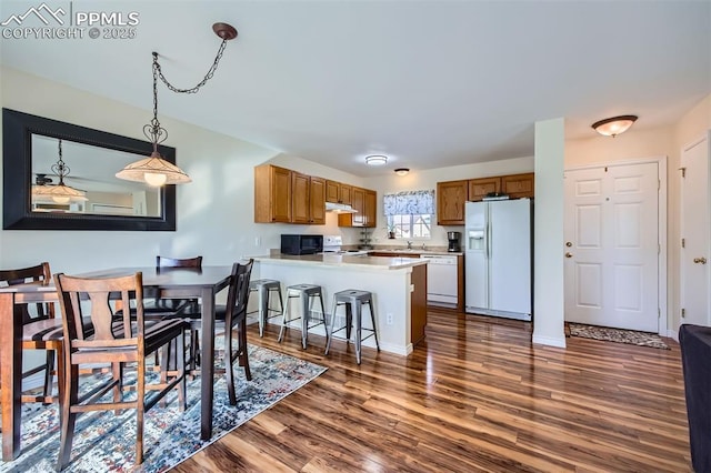 dining area with dark hardwood / wood-style floors