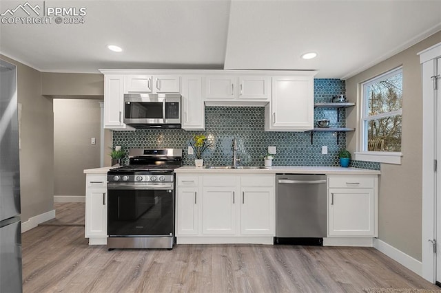 kitchen featuring appliances with stainless steel finishes and white cabinetry