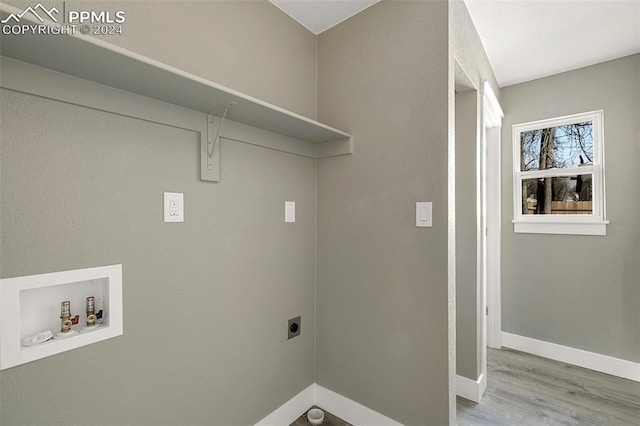 clothes washing area featuring hookup for an electric dryer, washer hookup, and light hardwood / wood-style floors