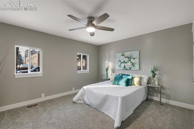 carpeted bedroom with ceiling fan