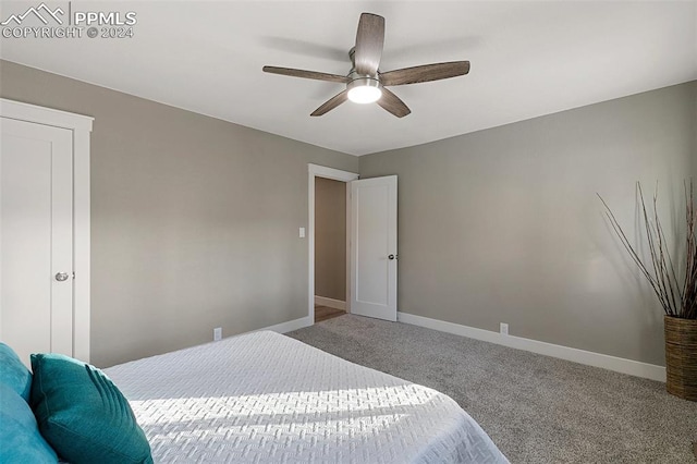 carpeted bedroom featuring ceiling fan