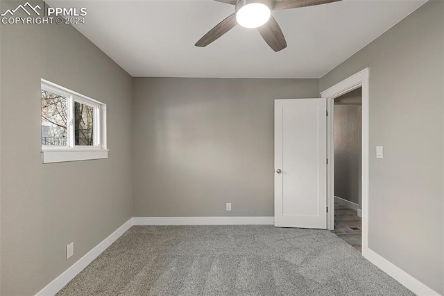 unfurnished bedroom featuring carpet flooring and ceiling fan