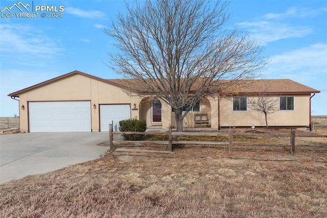 ranch-style home with a garage