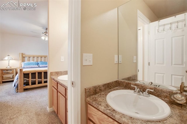 bathroom with ceiling fan and vanity