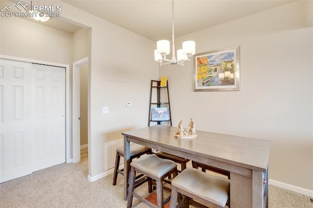 carpeted dining space with a notable chandelier