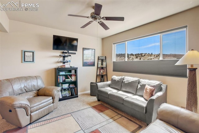 living room with light colored carpet and ceiling fan