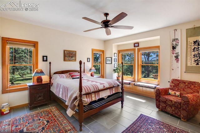 bedroom with tile patterned flooring and ceiling fan