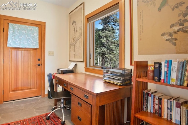 office space with plenty of natural light and light tile patterned floors