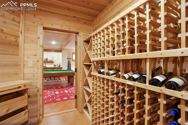 wine room featuring wood walls