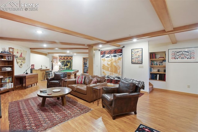 living room featuring beam ceiling, light hardwood / wood-style flooring, and billiards