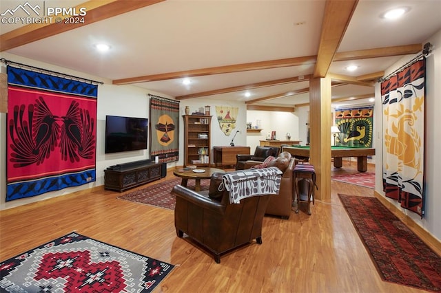 living room featuring beamed ceiling, wood-type flooring, and pool table