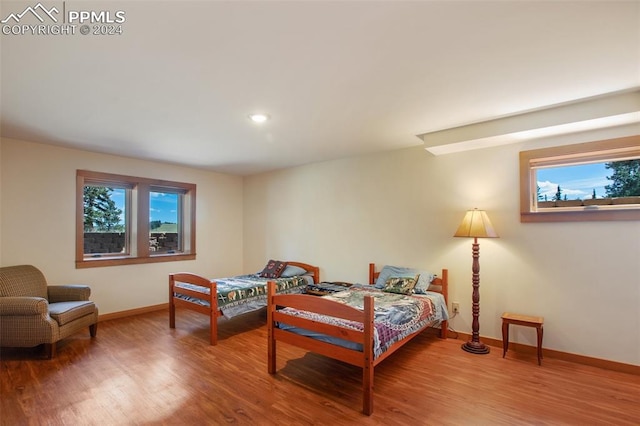 bedroom with wood-type flooring