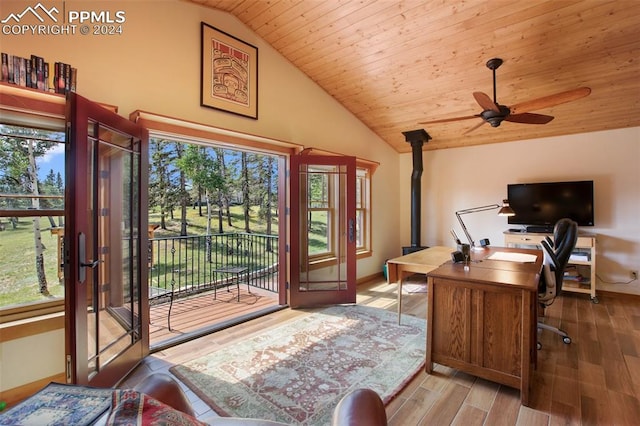 office space featuring wood ceiling, ceiling fan, a healthy amount of sunlight, and light wood-type flooring