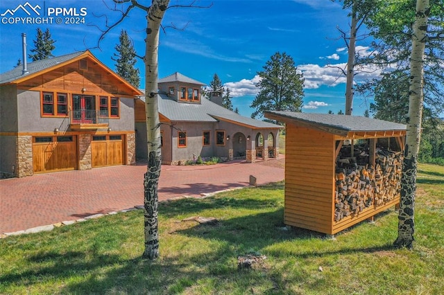 exterior space with a lawn and a garage