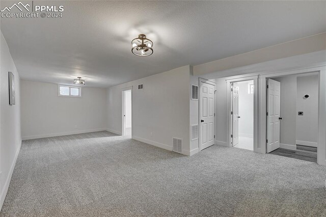 basement with carpet flooring