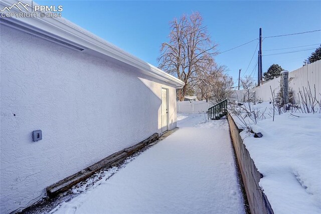 view of yard covered in snow