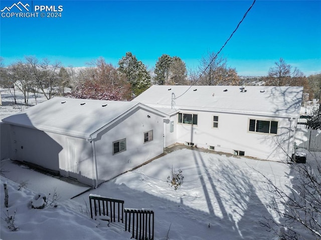 view of snow covered property