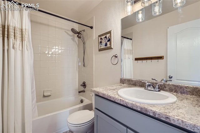 full bathroom with shower / bath combination with curtain, vanity, and toilet