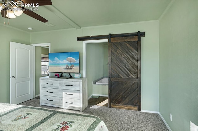 bedroom featuring dark colored carpet, crown molding, a barn door, and ceiling fan