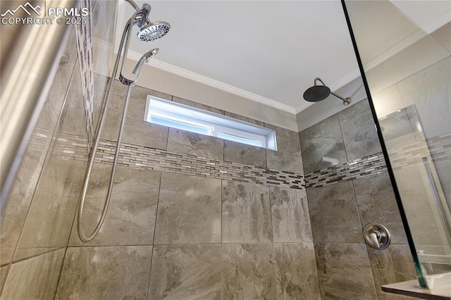 details with a tile shower and ornamental molding