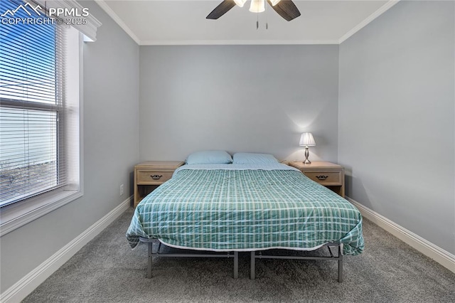 carpeted bedroom featuring ceiling fan and ornamental molding