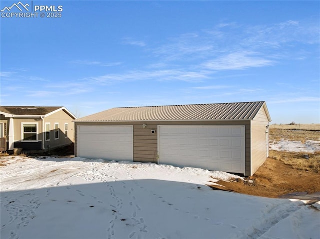 view of snow covered garage