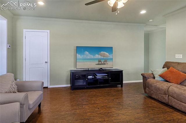 living room with dark hardwood / wood-style flooring, crown molding, and ceiling fan