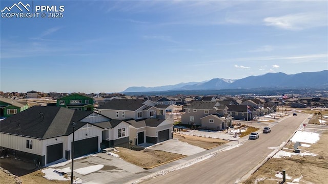 drone / aerial view featuring a mountain view and a residential view