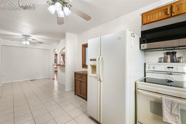 kitchen featuring ceiling fan, white appliances, and light tile patterned floors