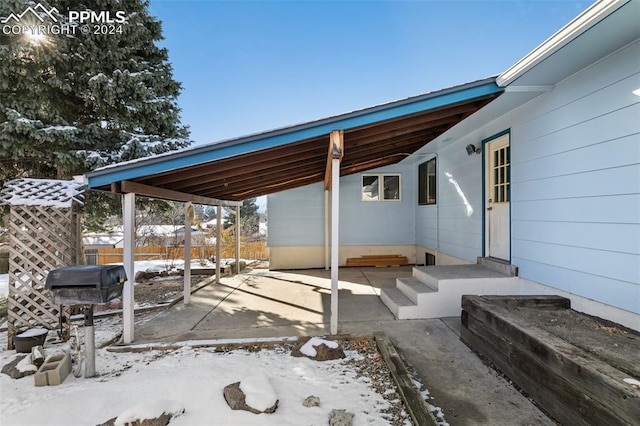 view of snow covered patio