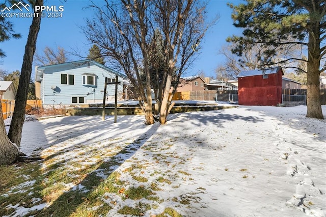 view of yard layered in snow