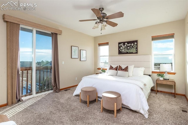 carpeted bedroom with ceiling fan and access to exterior