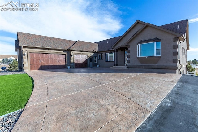 single story home with a garage