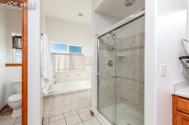 full bathroom with tile patterned flooring, vanity, toilet, and independent shower and bath