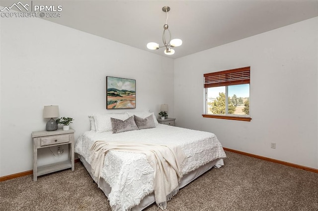 carpeted bedroom with an inviting chandelier