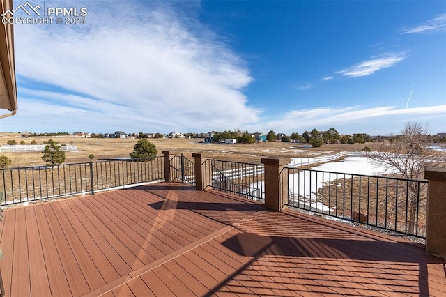 wooden terrace with a rural view