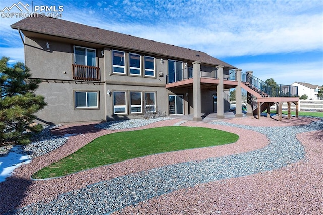 back of property with a patio area