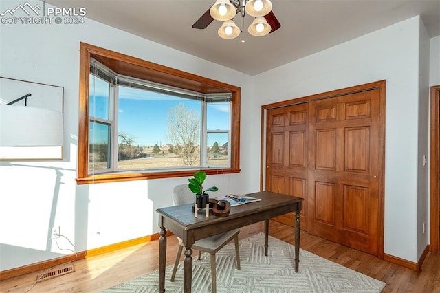 office area with ceiling fan and light hardwood / wood-style floors