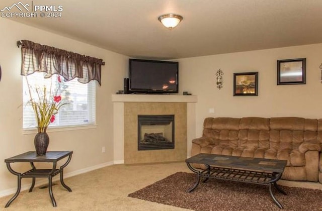 living room featuring carpet flooring and a fireplace