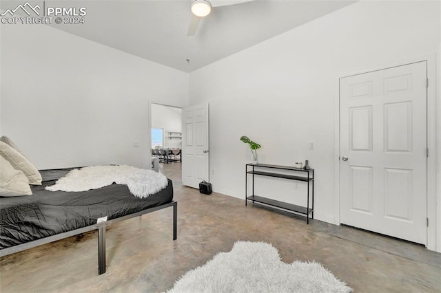 bedroom featuring ceiling fan and concrete floors