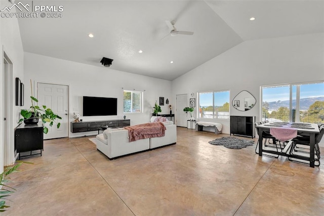 living room featuring high vaulted ceiling, ceiling fan, and a wealth of natural light