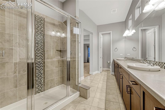 bathroom featuring tile patterned flooring, vanity, an enclosed shower, and lofted ceiling