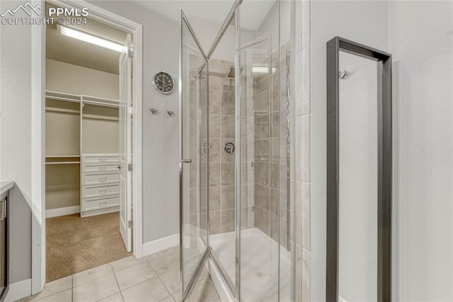 bathroom with vanity, tile patterned floors, and an enclosed shower