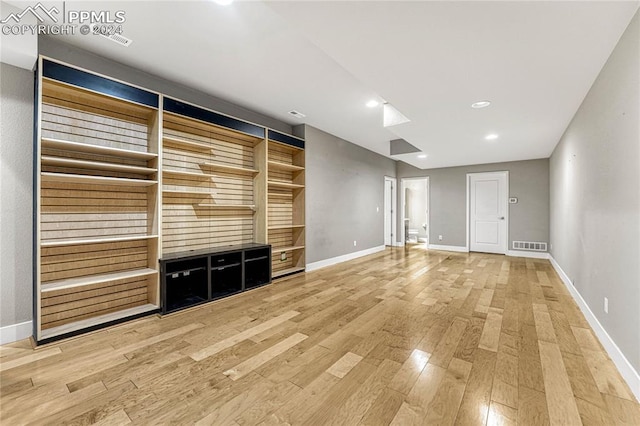 unfurnished living room featuring light wood-type flooring