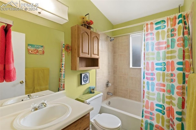 full bathroom with vanity, shower / tub combo, and toilet