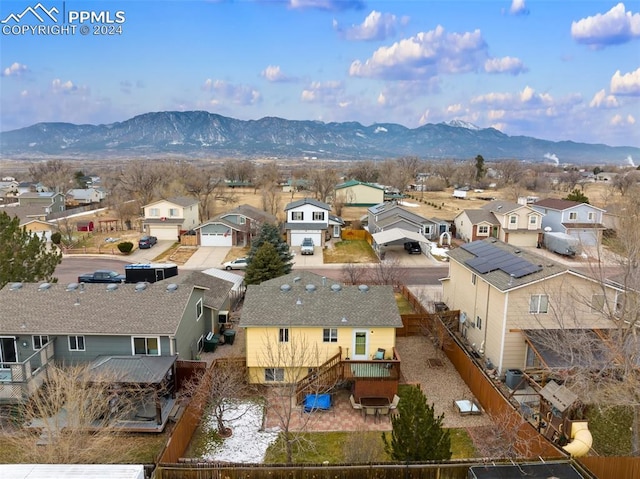 birds eye view of property with a mountain view