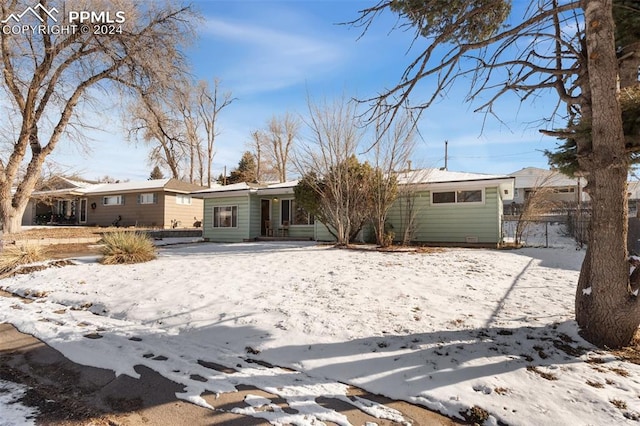 view of snow covered property