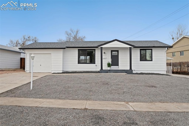 ranch-style home featuring a garage